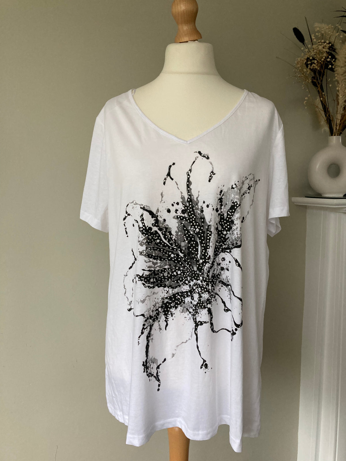 White top with black flower design - Size 18